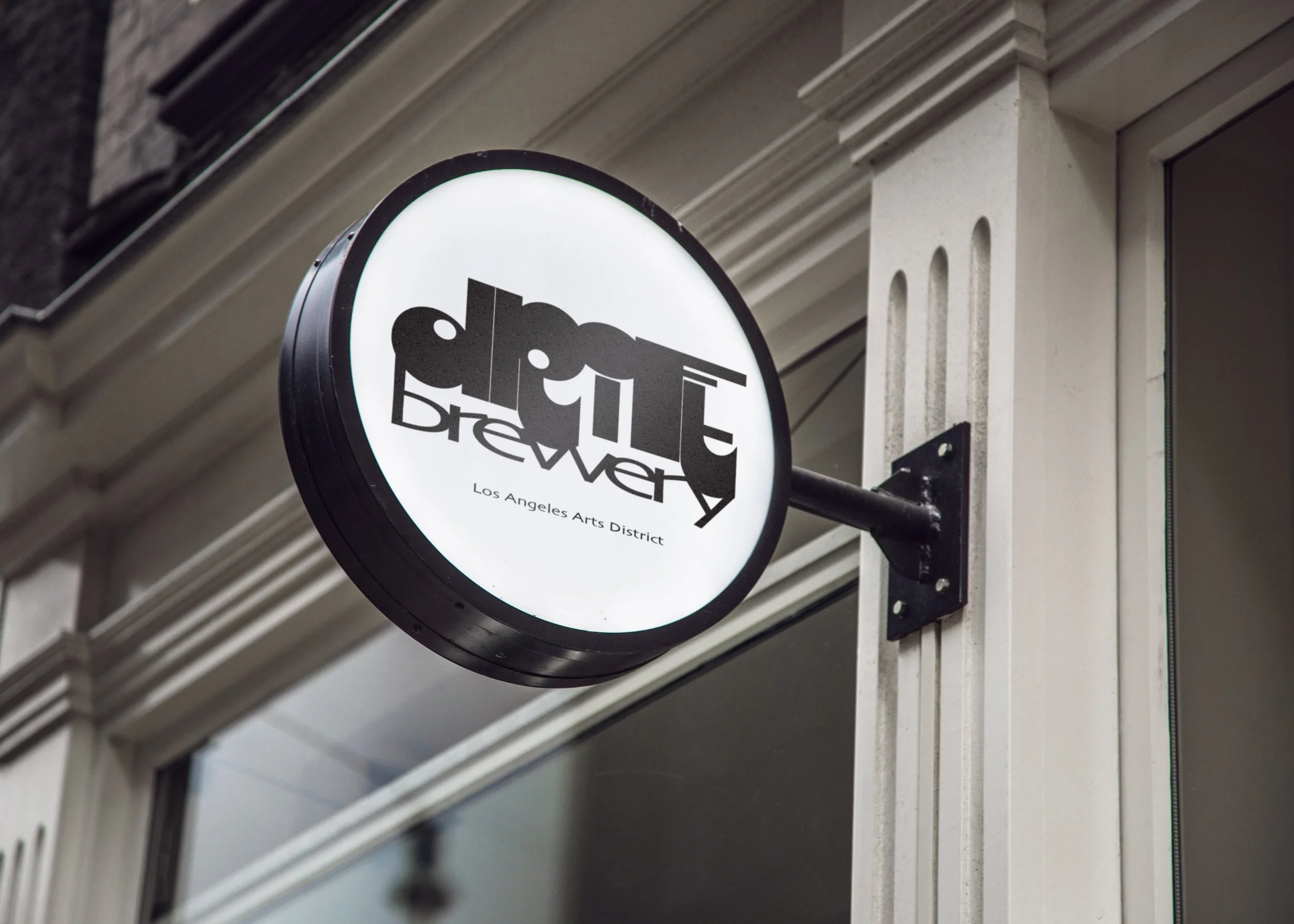 Circular illuminated exterior sign mockup displaying the black Drift Brewery logo on a white background