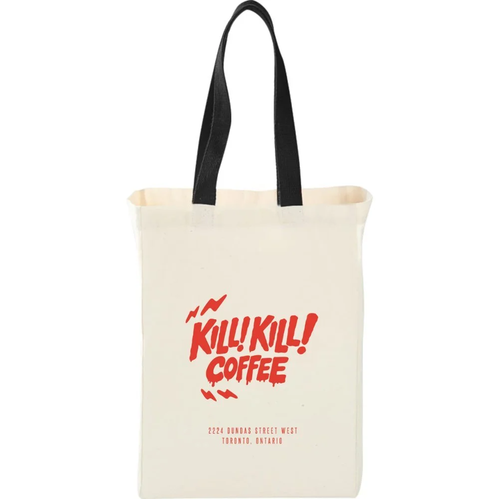 Natural canvas tote bag with black handles and the Kill! Kill! Coffee logo printed in red.