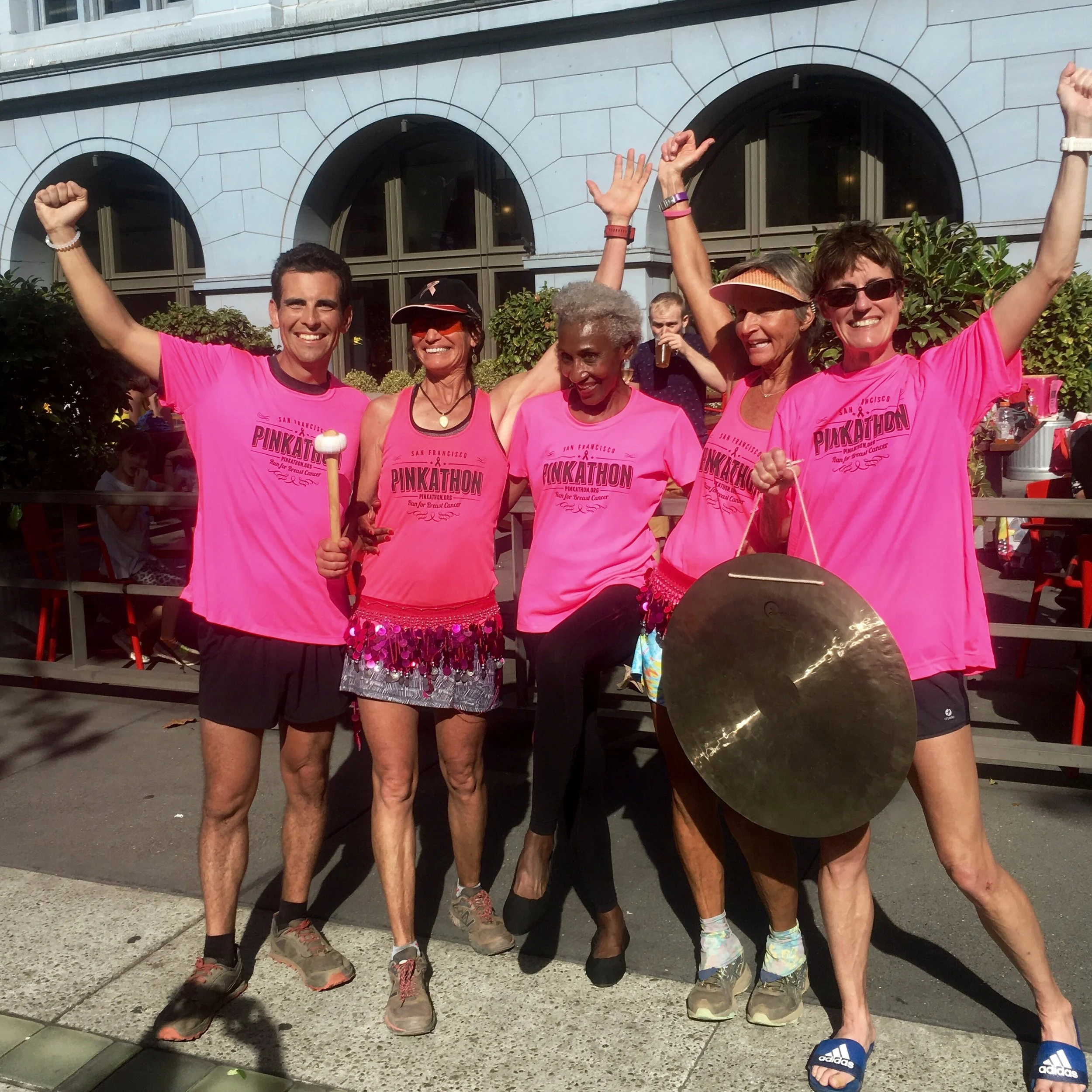 Ashley Martinez standing with finishers of the San Francisco pink-a-thon 50k.