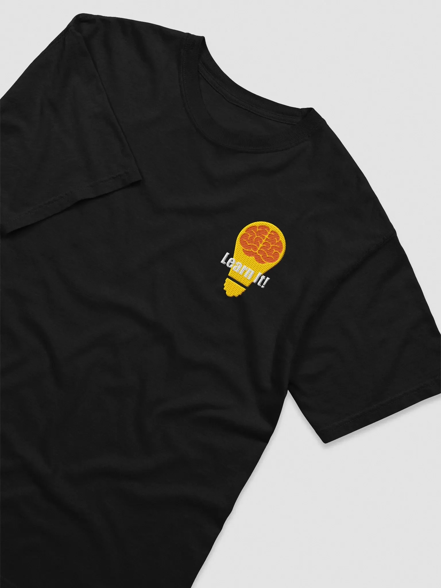 Black Learn It! T-shirt featuring the channel's lightbulb logo.
