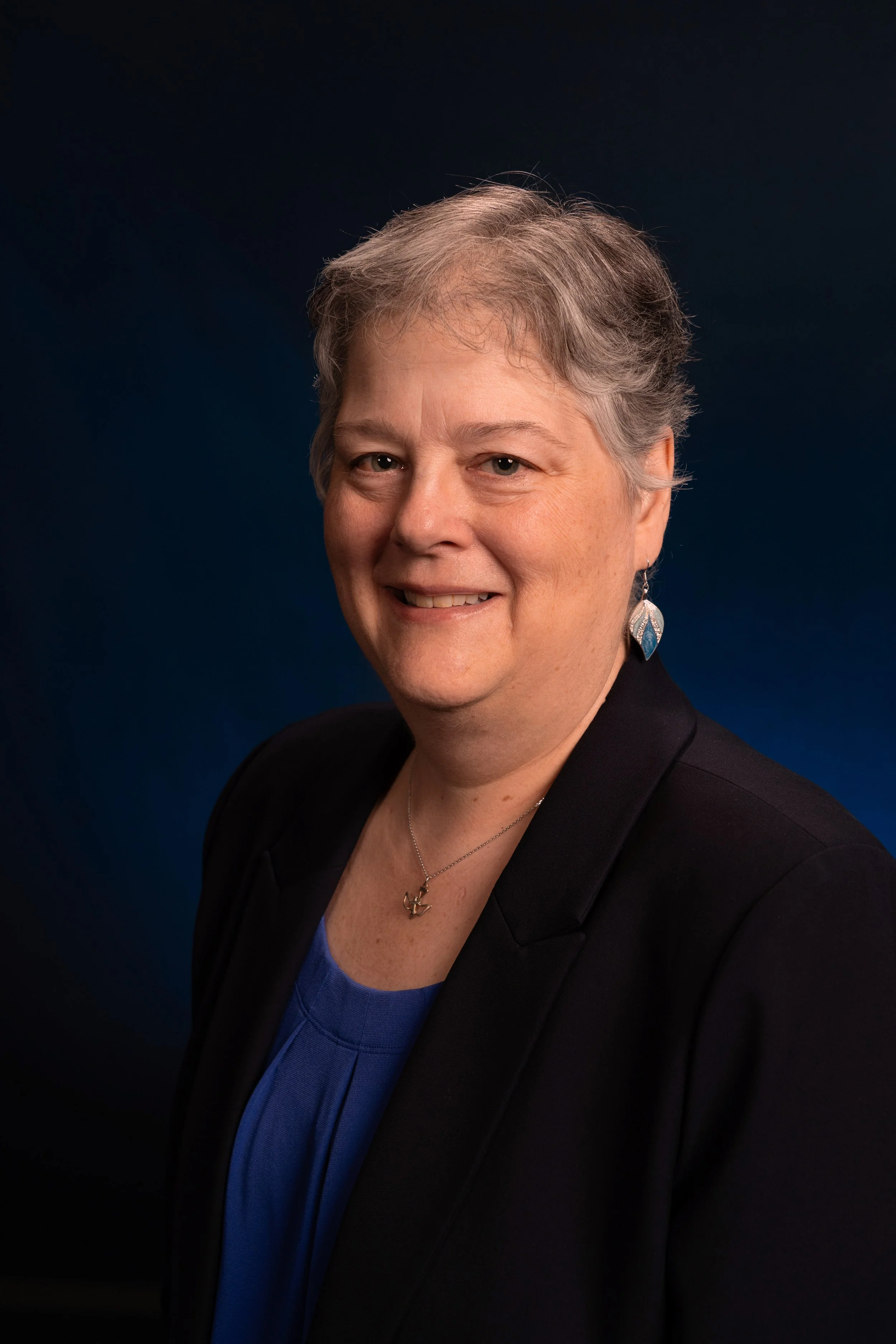Lisa Higby Carboni, occupational safety consultant, university educator, and founder of Elevation Safety Services, in a professional portrait.