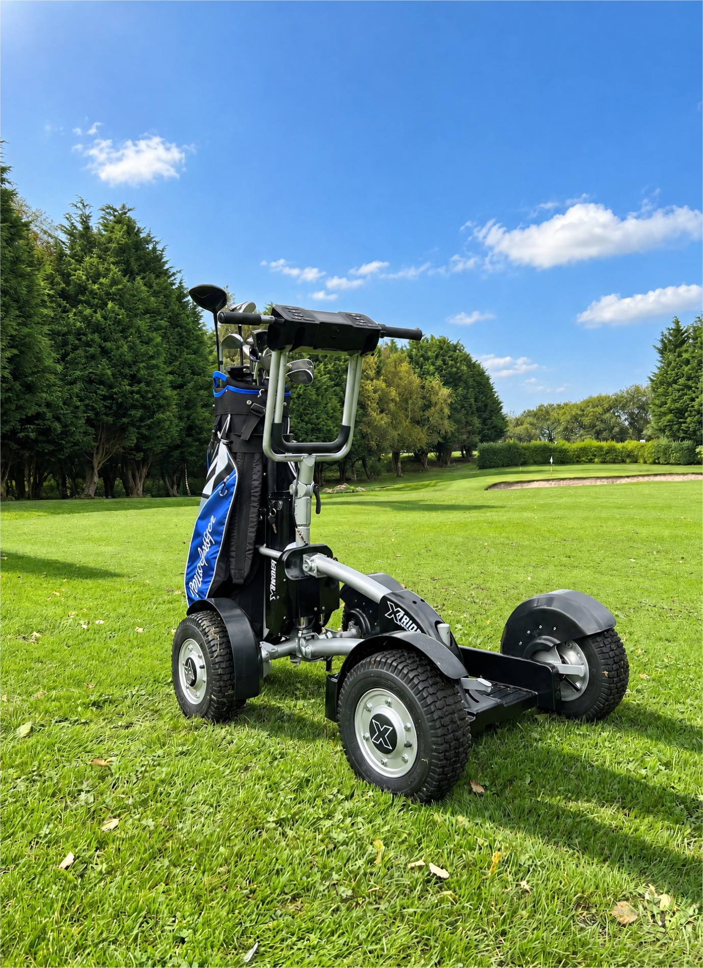 Electric golf push cart with a golf bag on a sunny golf course