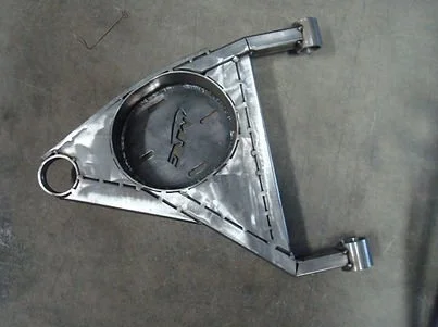 Triangular metal automotive suspension component with a large circular opening and mounting brackets