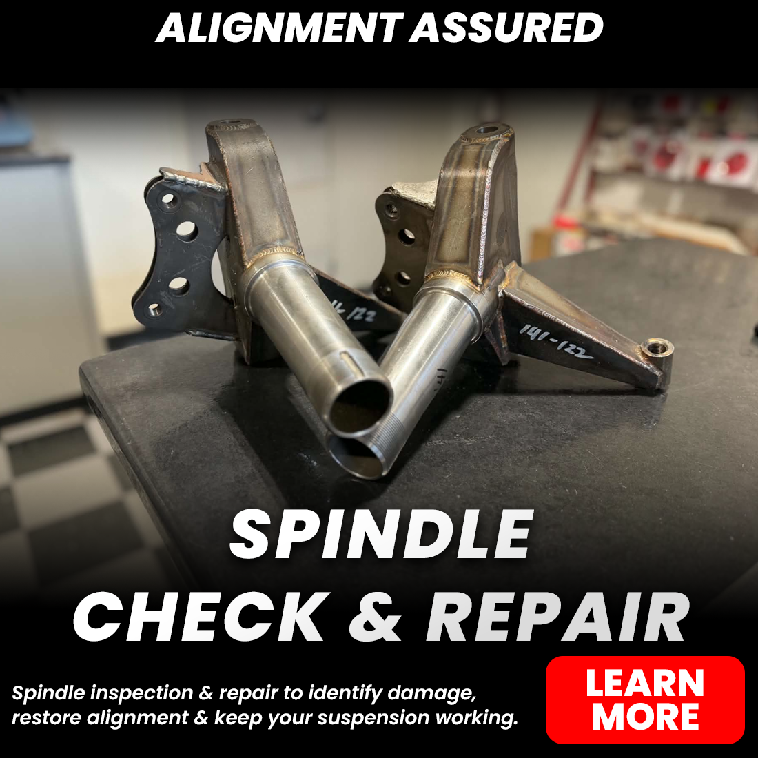 Welded metal suspension spindles on a workbench with text promoting spindle inspection and repair.