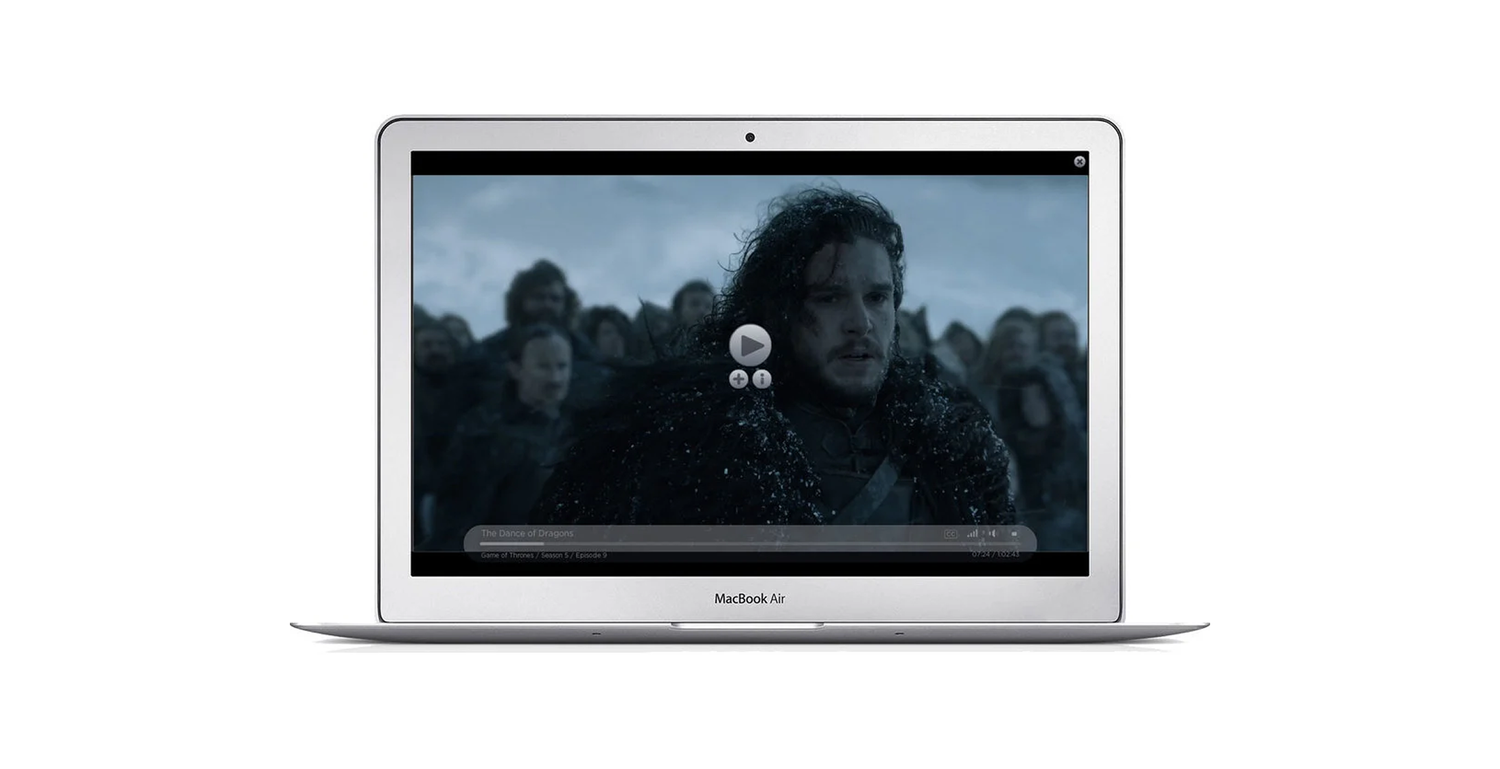Silver MacBook Air displaying a scene from Game of Thrones with Jon Snow in a dark and chilly setting.