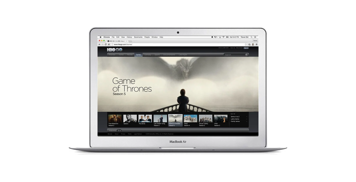 Silver MacBook Air displaying HBO GO website with a screen featuring Game of Thrones season 5 and other series