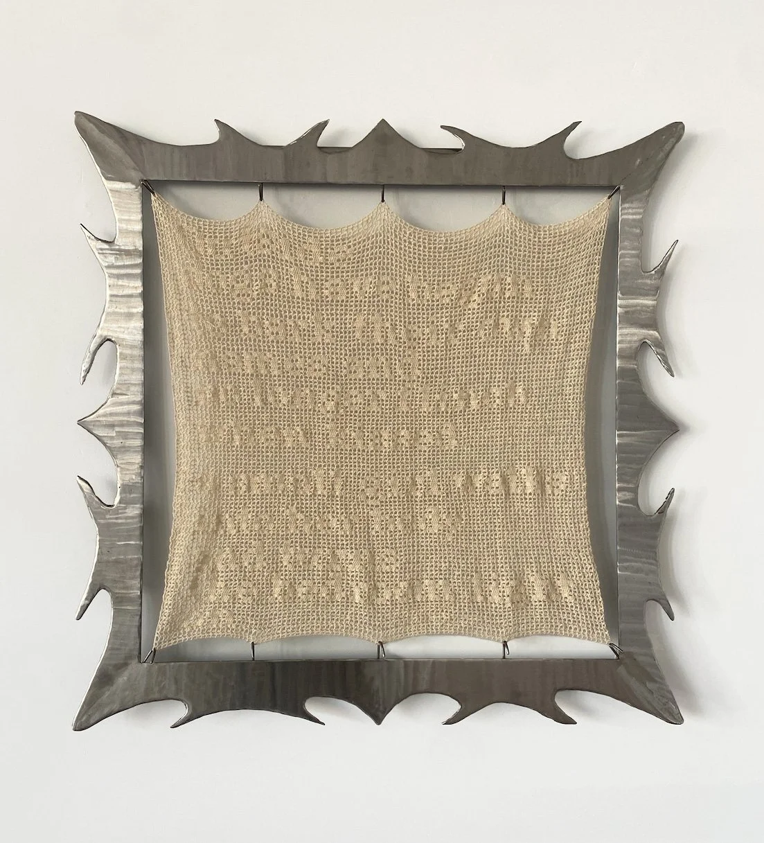 A Small Girl Walks Into Her Body, 2025. Welded steel, cotton yarn filet crocheted tapestry.