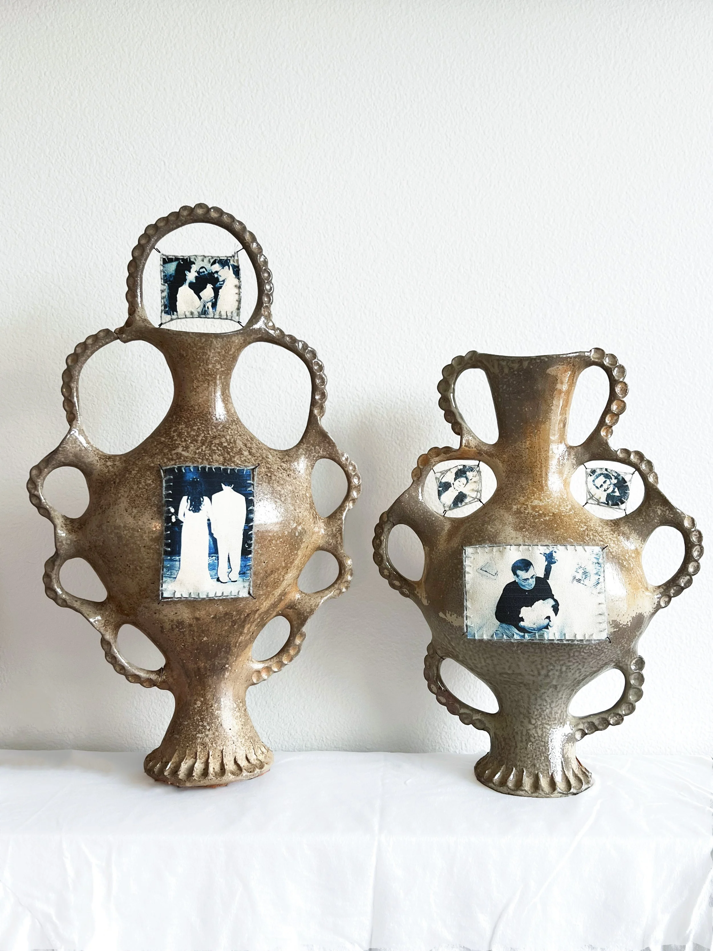 Family Trees, 2025. Atmospherically wood fired to cone 10 with wood ash finish on bare clay, cyanotype family images on canvas, mohair yarn crocheted bordering, and nichrome wire hooks. 