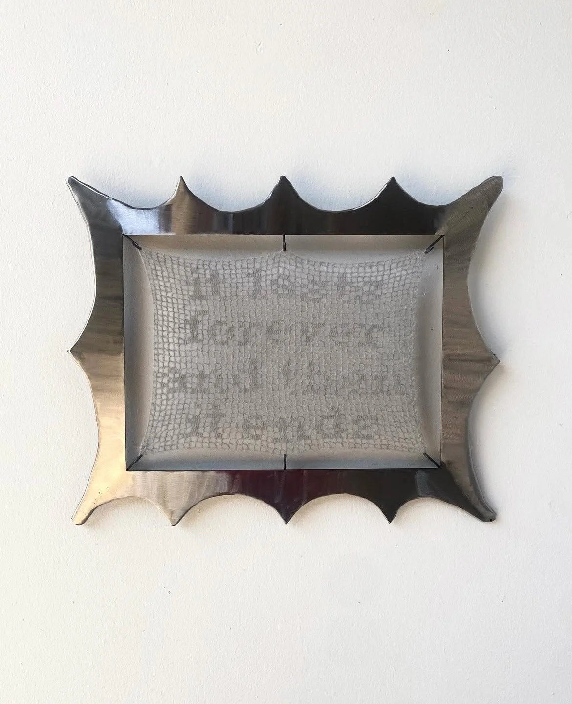 It Lasts Forever and Then it Ends, 2025. Welded steel, mohair yarn filet crocheted tapestry.