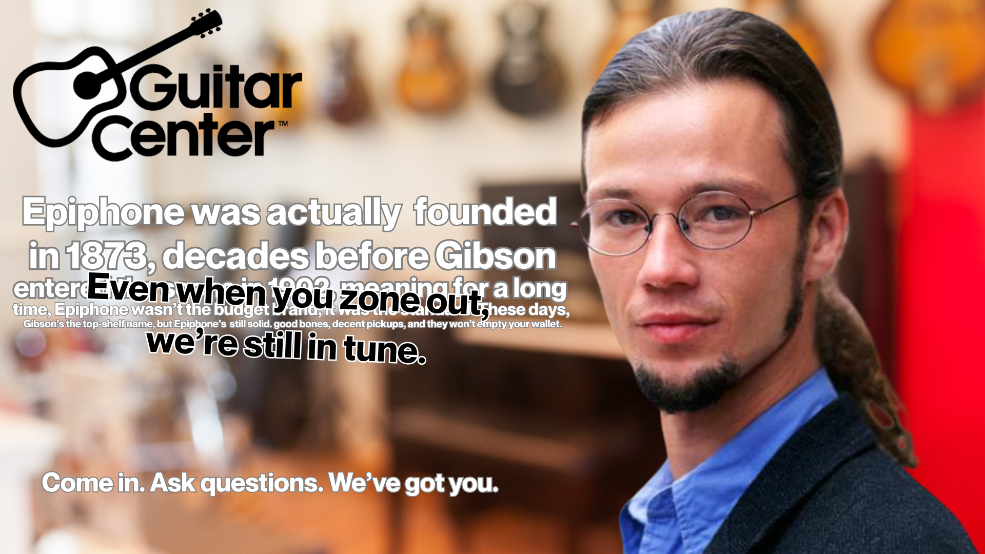 A man with glasses and a goatee looking at the camera, standing in a store with guitars hanging on the wall behind him. The image contains the Guitar Center logo and text about the history of Epiphone guitars and a promotional phrase encouraging customers to ask questions.