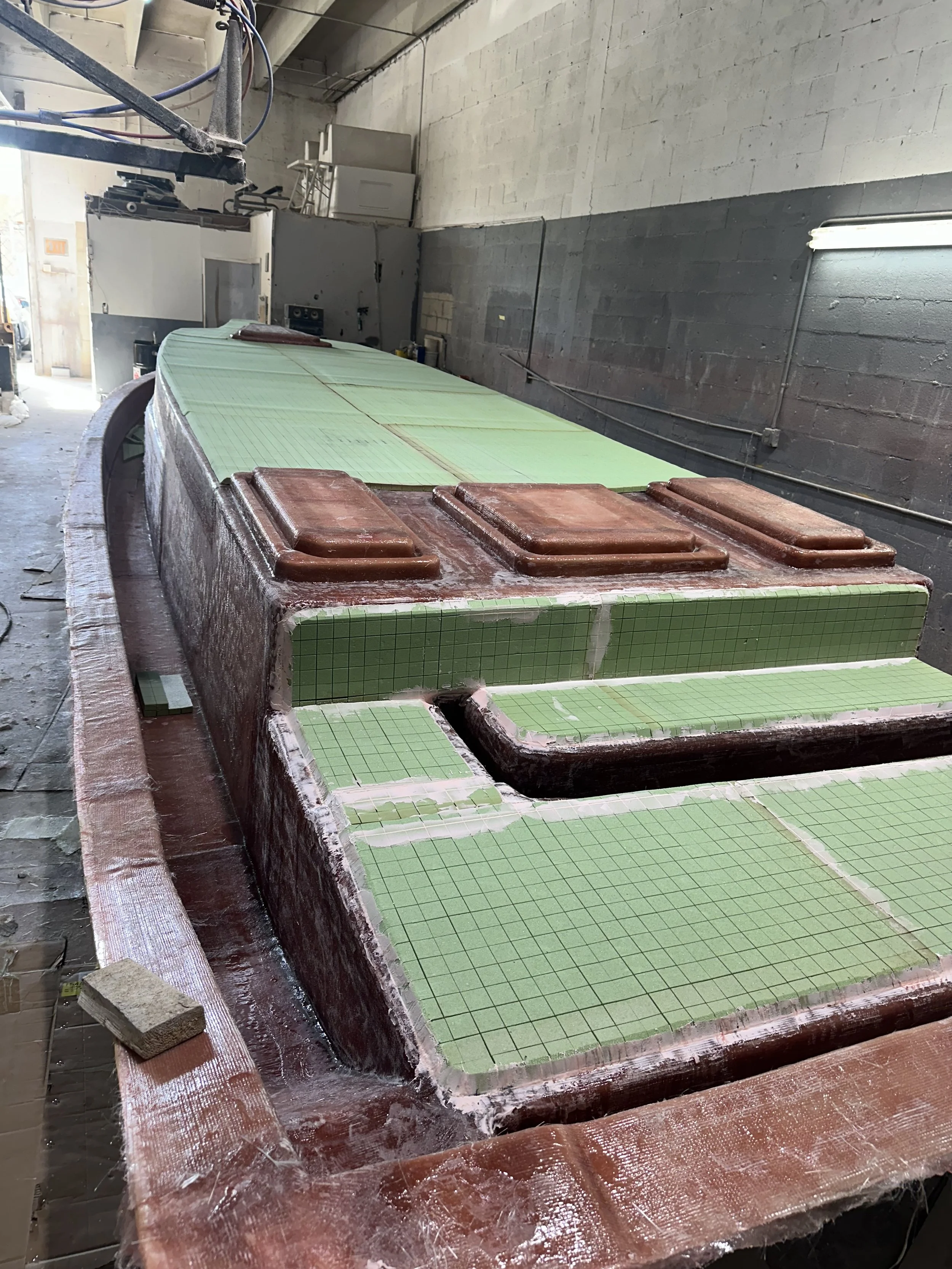 Layer-by-Layer Construction: Fiberglass, reinforcement, foam core, and bonding compound are applied in sequence, with careful attention to every stage of the build.
