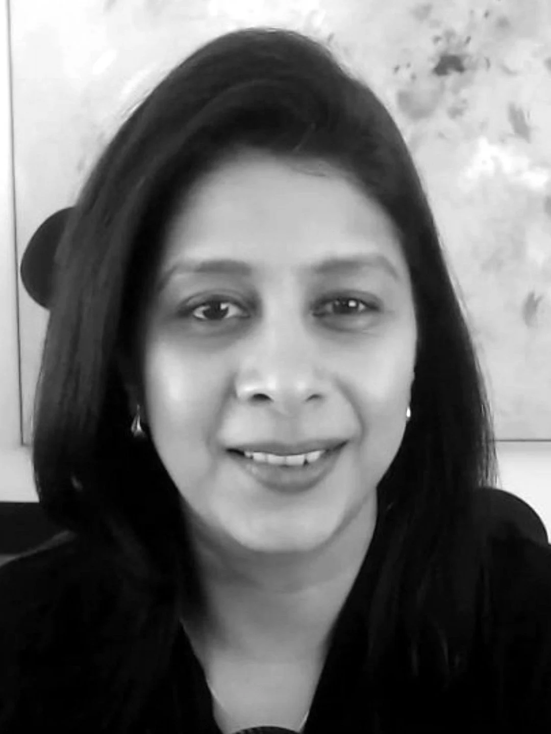 Black and white headshot of Vidhi Bhansali, host of The South Asian Impact Project