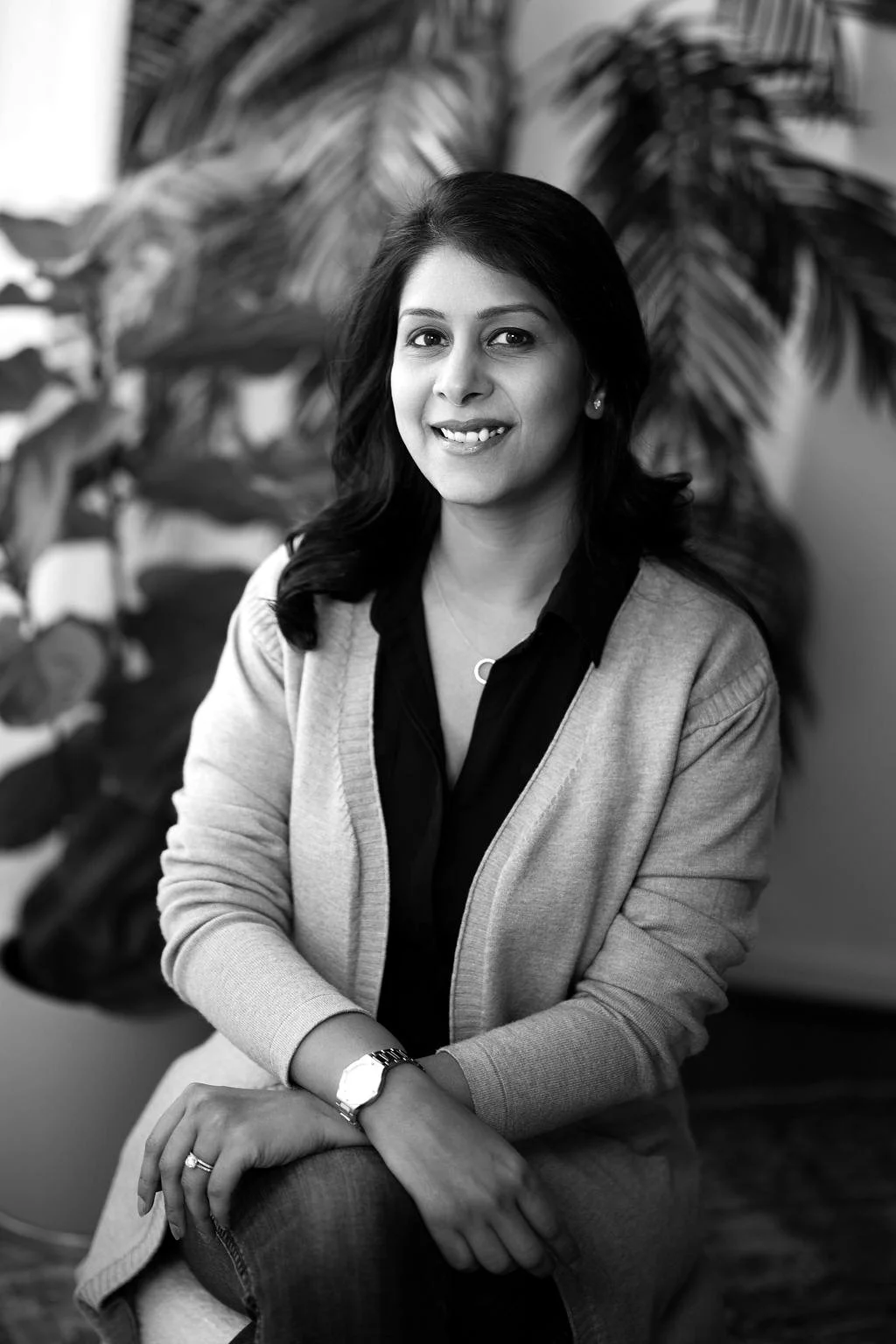 Vidhi Bhansali, GTM advisor, smiling and seated among leafy plants