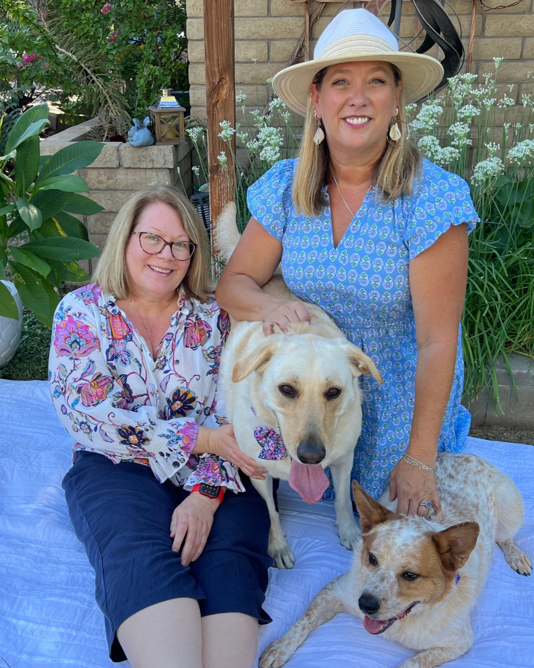 Local Laps owner Tara with Lana (Director of Snuggles & Snacks), sharing the love and personal attention behind their pet care services.
