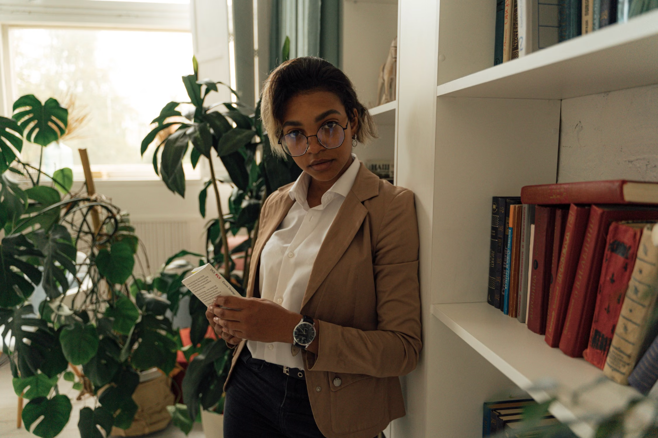 Express Funding Service team member in a professional office setting with bookshelf
