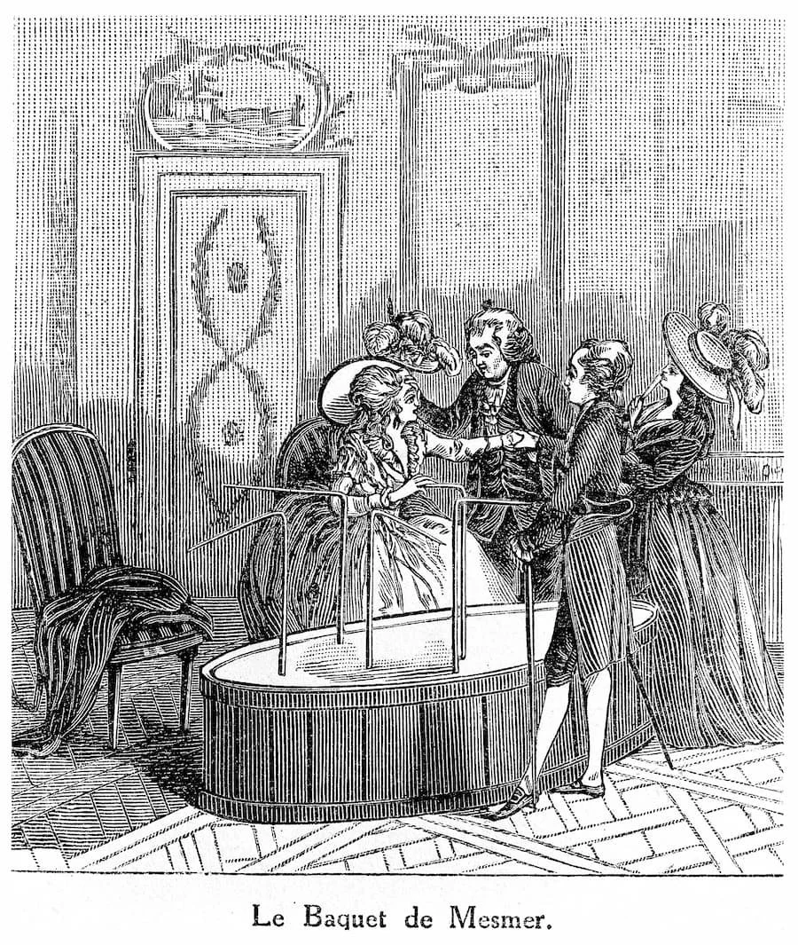 Engraving of a crowded salon where people sit around a large tub connected by cords.