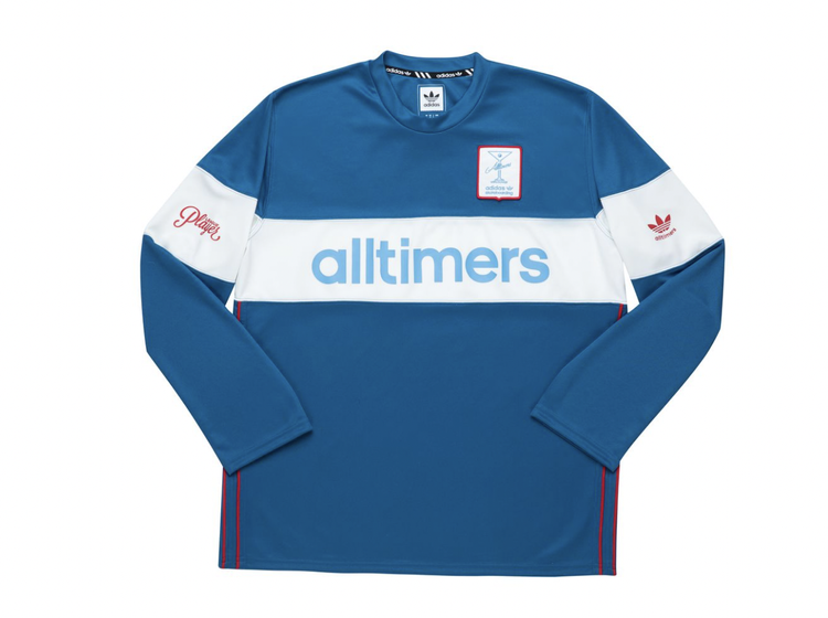 Blue long sleeve soccer jersey with white horizontal stripe across chest, featuring 'alltimers' logo in blue, red embroidered 'playing' on left sleeve, and Adidas logo on right sleeve.