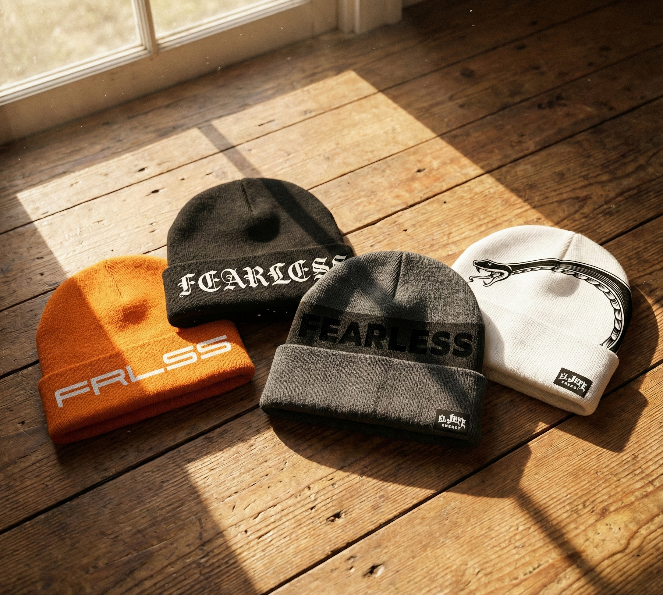 Five beanie hats in different colors and designs arranged on a wooden surface near a window with sunlight casting shadows.