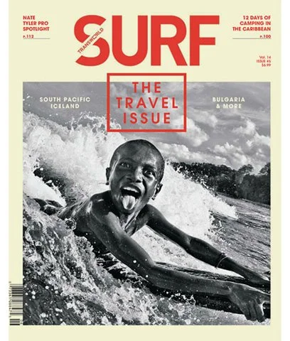 Cover of Surf magazine featuring a young boy surfing in the ocean, with waves crashing around him. The magazine's title is in large red text, and there are headlines about travel destinations like South Pacific, Iceland, and Bulgaria.