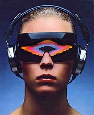 A woman wearing large headphones and futuristic sunglasses with a colorful digital pattern, against a blue background.