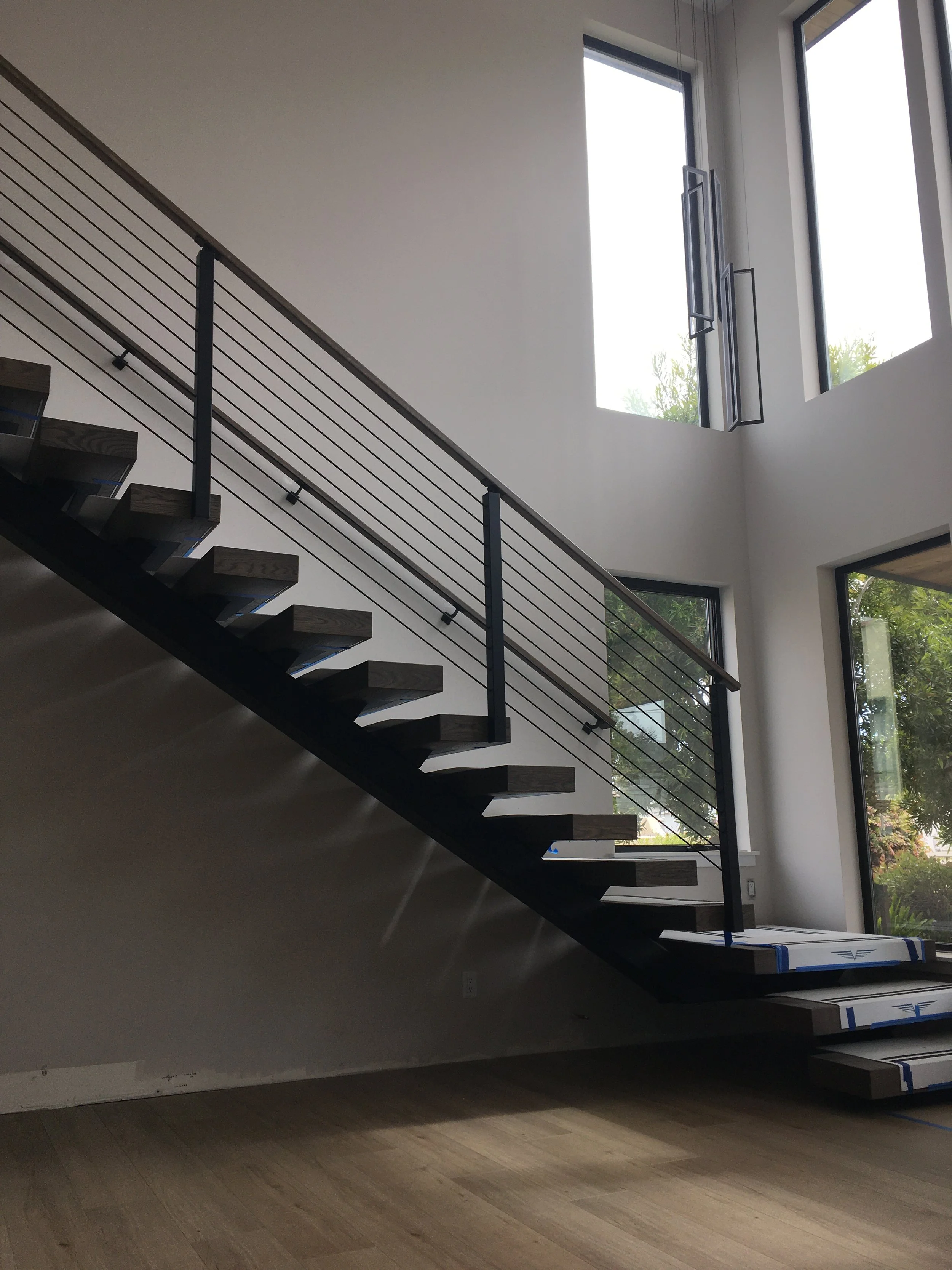 FLOATING STAIRCASE DESIGNED, WELDED, AND FABRICATED BY CAYUCOS METALWORKS FOR A PROJECT IN MORRO BAY
