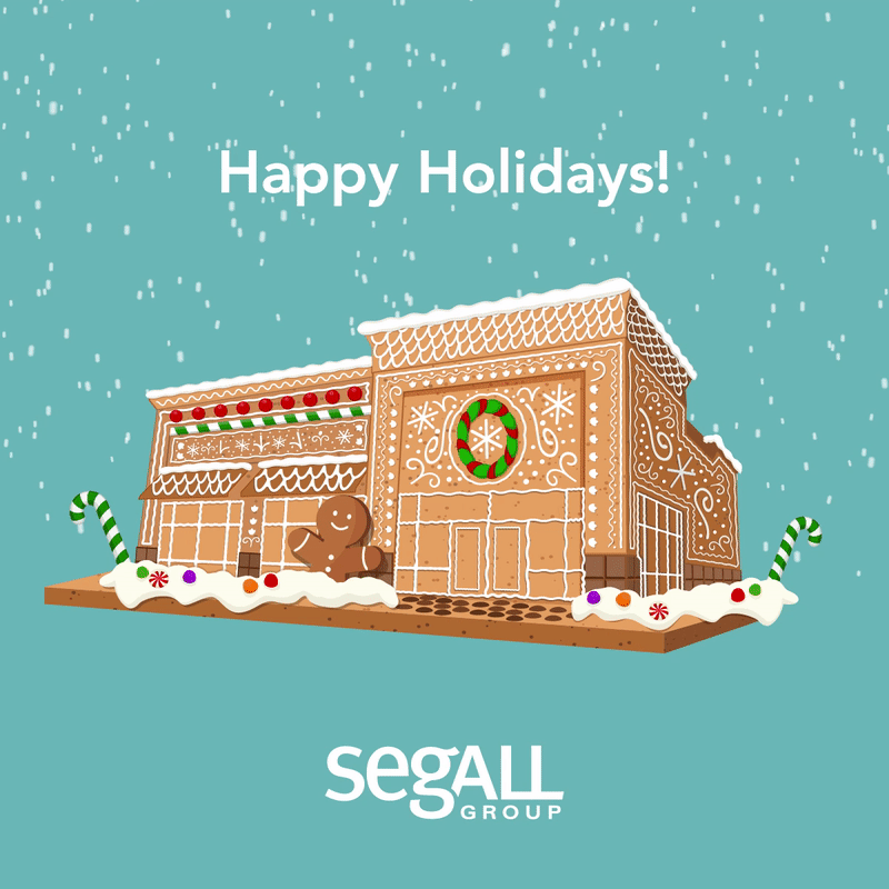 Holiday greeting card with gingerbread house decorated with icing and candies, snow falling, and the text 'Happy Holidays!'