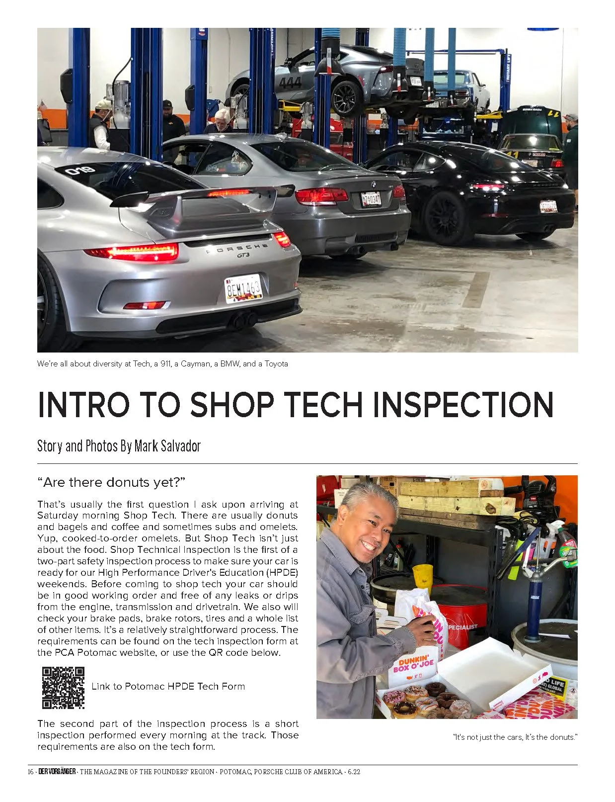 An indoor automotive workshop with several cars, including a Porsche 911 and BMW, being inspected on hydraulic lifts. There are a few people working and observing around the vehicles.