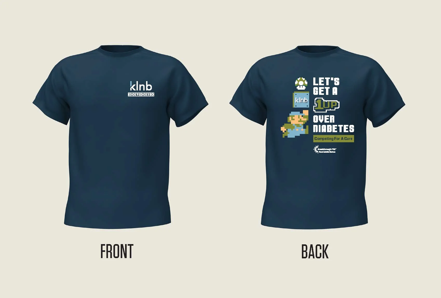 A navy blue T-shirt with the logo "klnb" on the front. The back features a colorful pixel art design with text that reads "Let's get a 1UP over diabetes" and includes a pixel Mario character, a 1UP mushroom, and the logo of the Juvenile Diabetes Rese