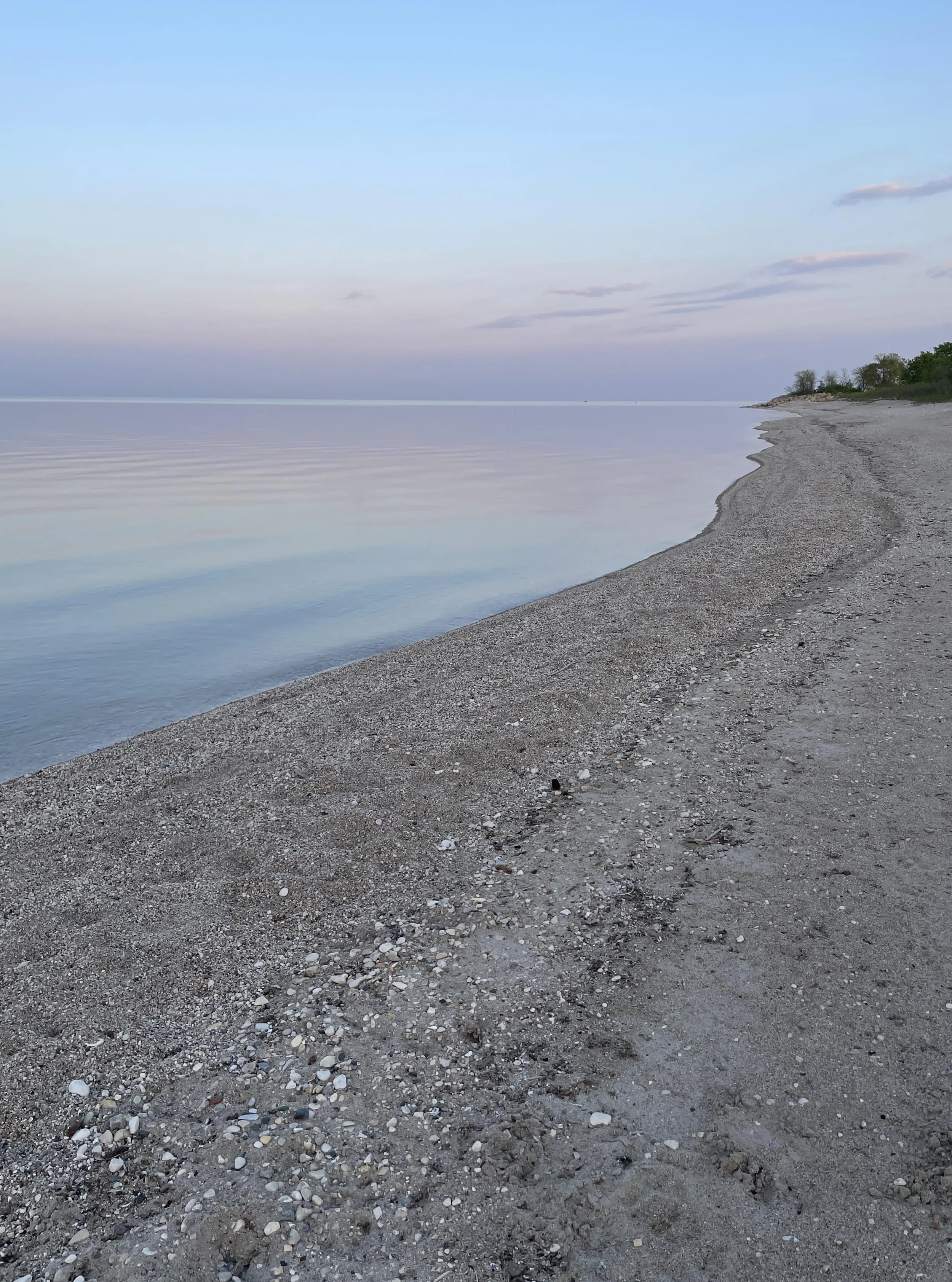 Shore of Lake Winnipeg at dusk.