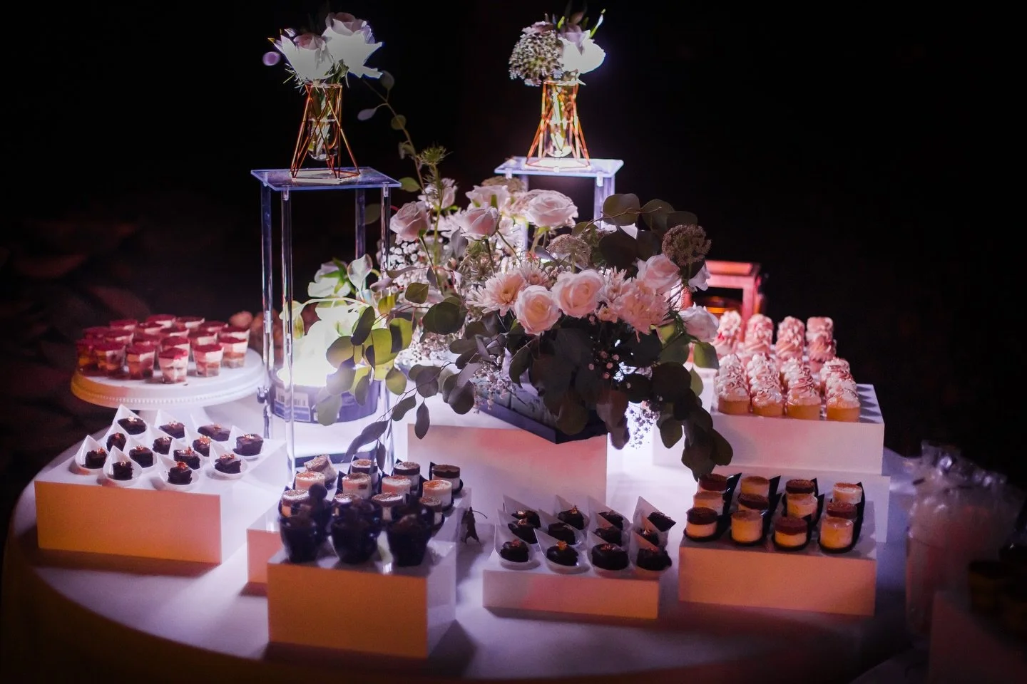 Wedding grazing display with white florals and candlelight by Catering by Rotem