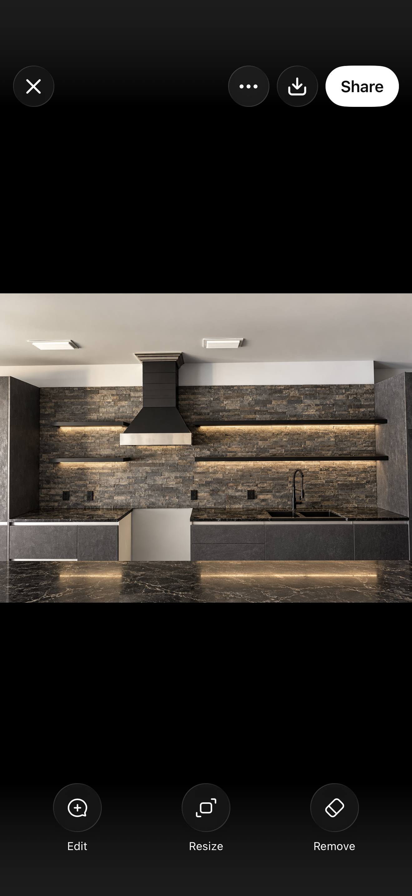 Custom kitchen backsplash featuring dark stacked stone, under-cabinet lighting, and coordinating stone countertops for a modern luxury kitchen.