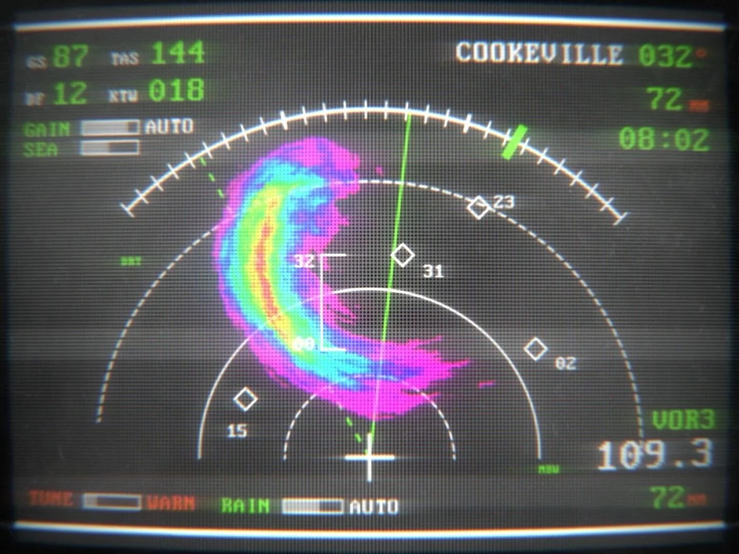 Radar screen with weather pattern in various colors indicating storm activity, over ocean, with data and coordinates displayed. From the movie the Shift