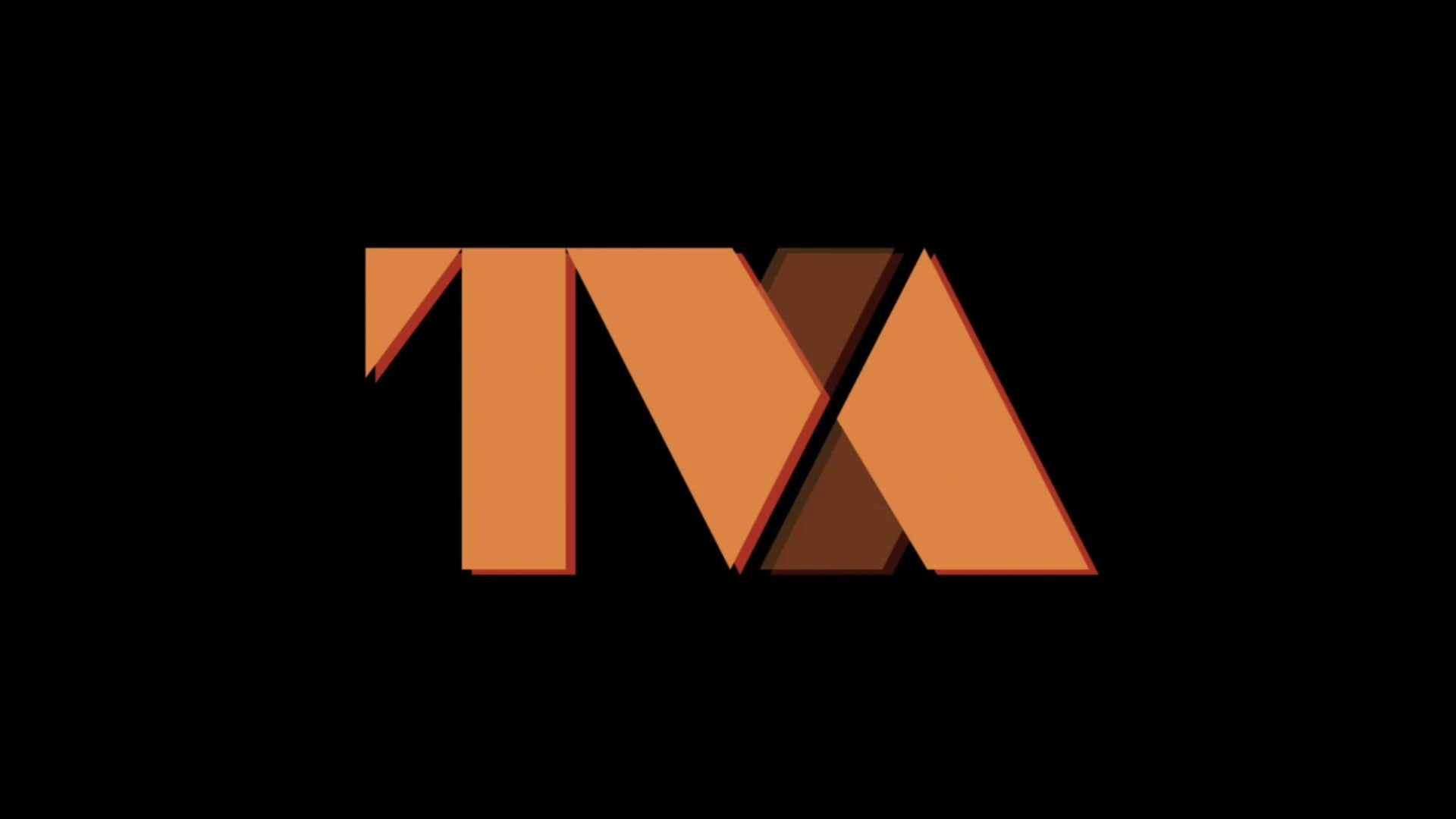 TVA logo exploration: solid orange and brown block letters on black