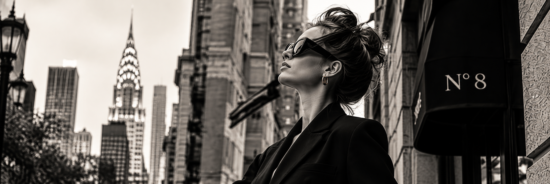 Woman with hair swept up and sunglasses in New York City