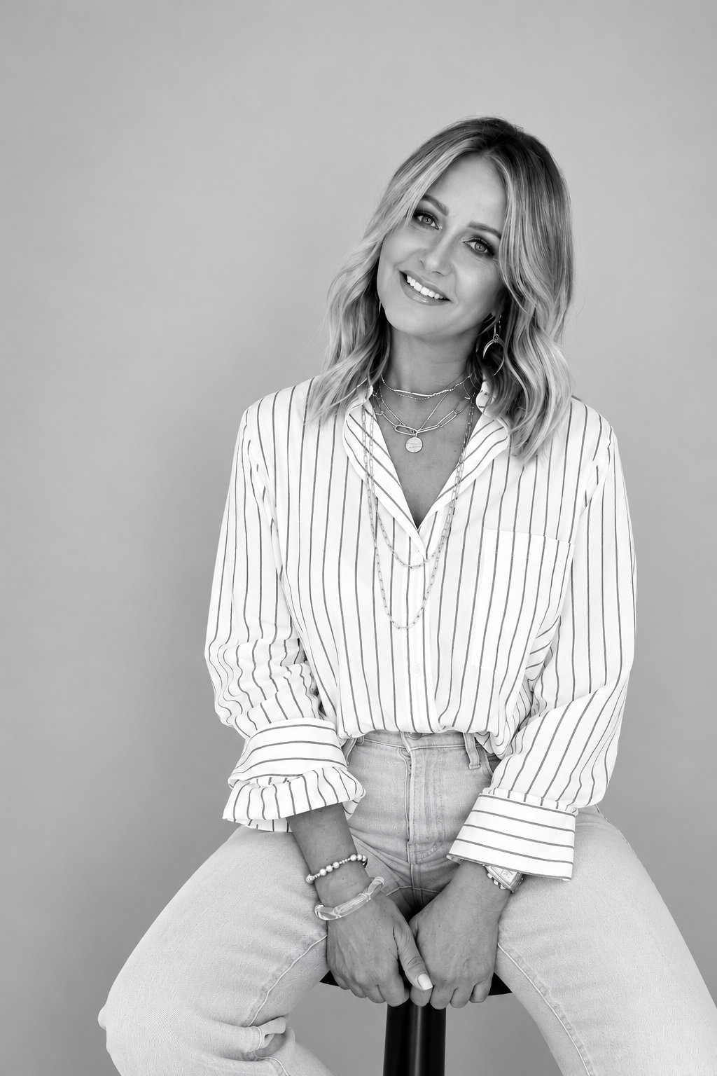Photo of Lisa Cole in black and white with a striped shirt