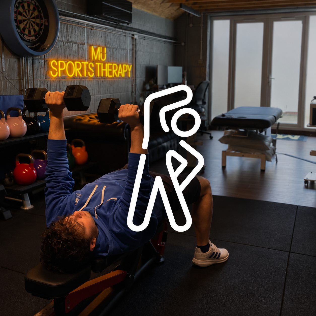 Max performing a dumbbell bench press in the clinic gym, with personal training icon