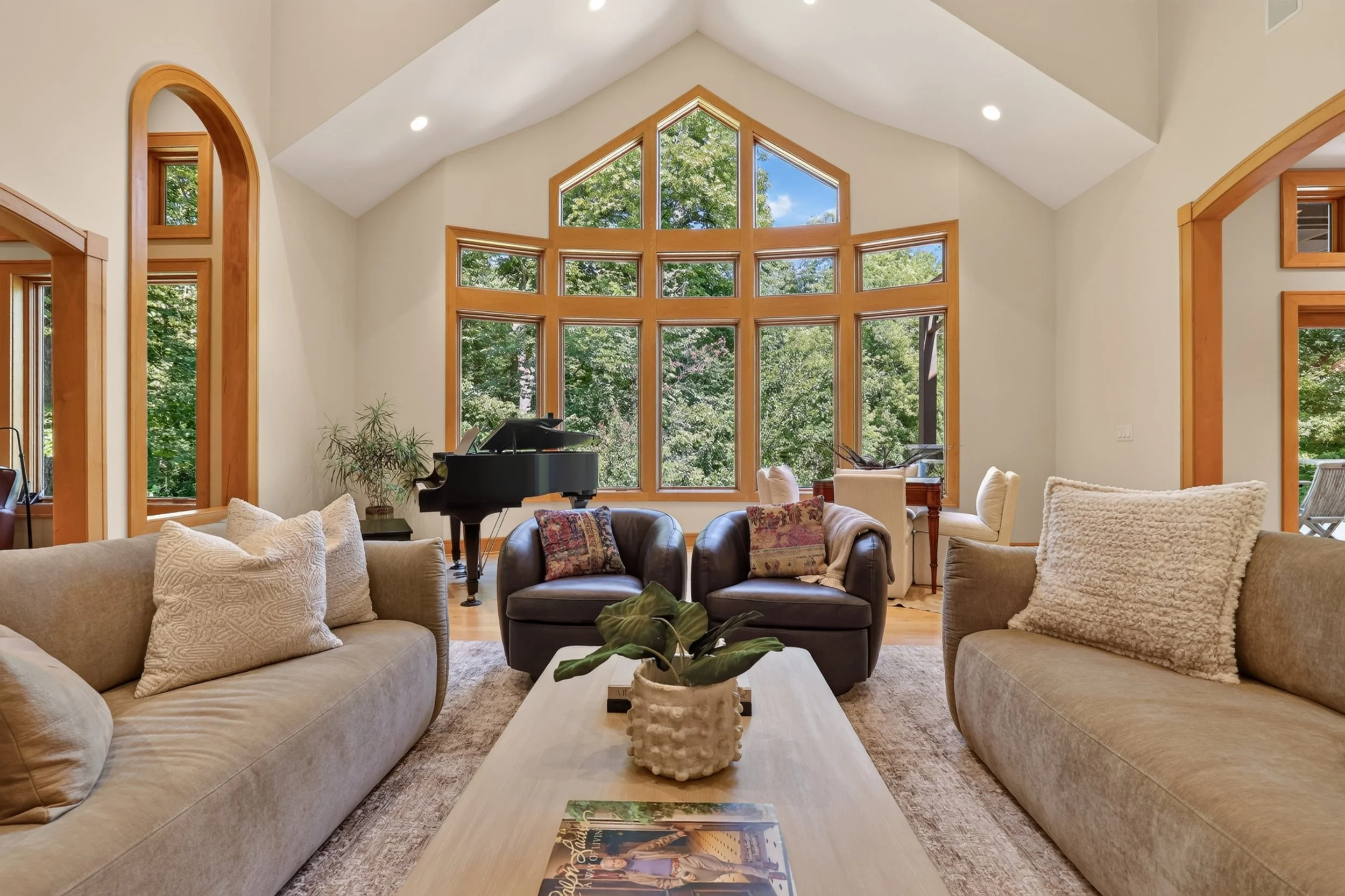 Vaulted great room with floor-to-ceiling gable windows, real estate photography in Rochester MN
