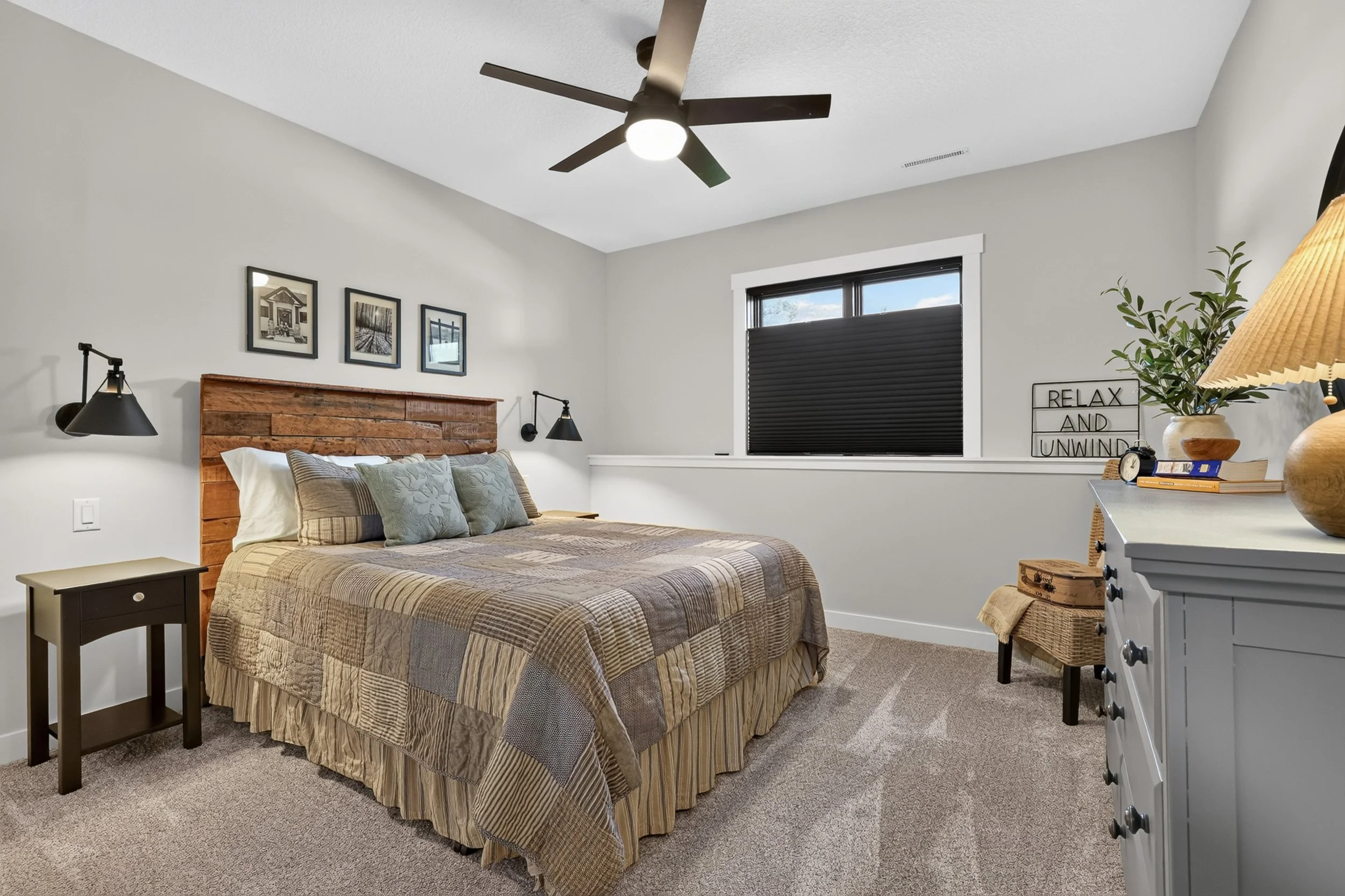 Lower-level bedroom with reclaimed wood headboard, Rochester MN real estate photography