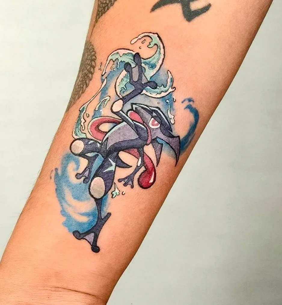 Tattoo of Gengar, a purple ghost Pokémon, with a red droplet, surrounded by blue and white water splashes on a person's arm.