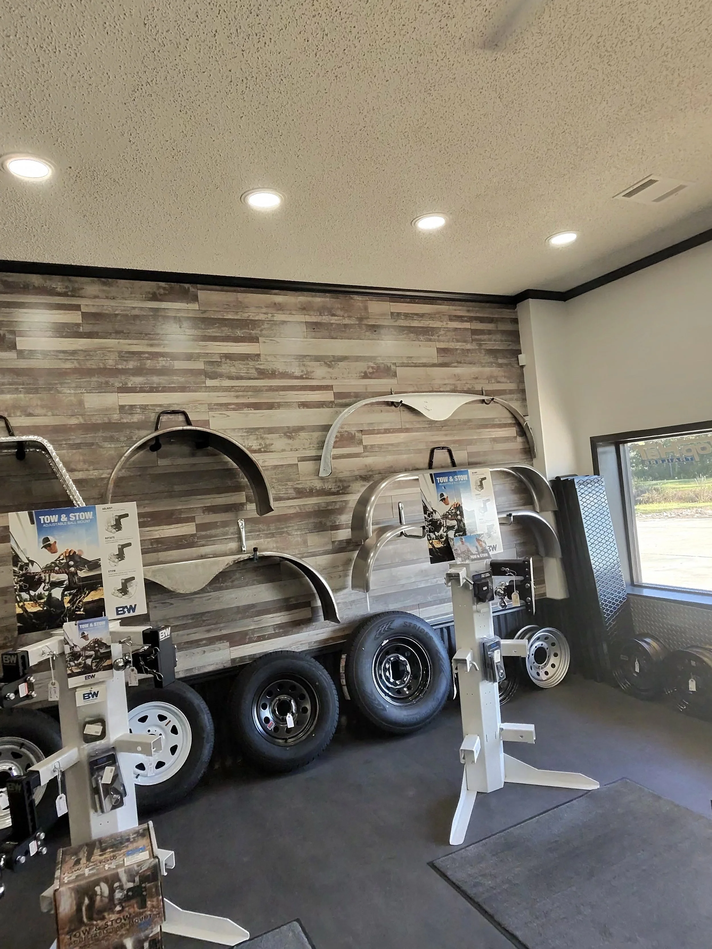 Trailer fenders, trailer tires and B&W Tow and Stow hitches in the trailer shop
