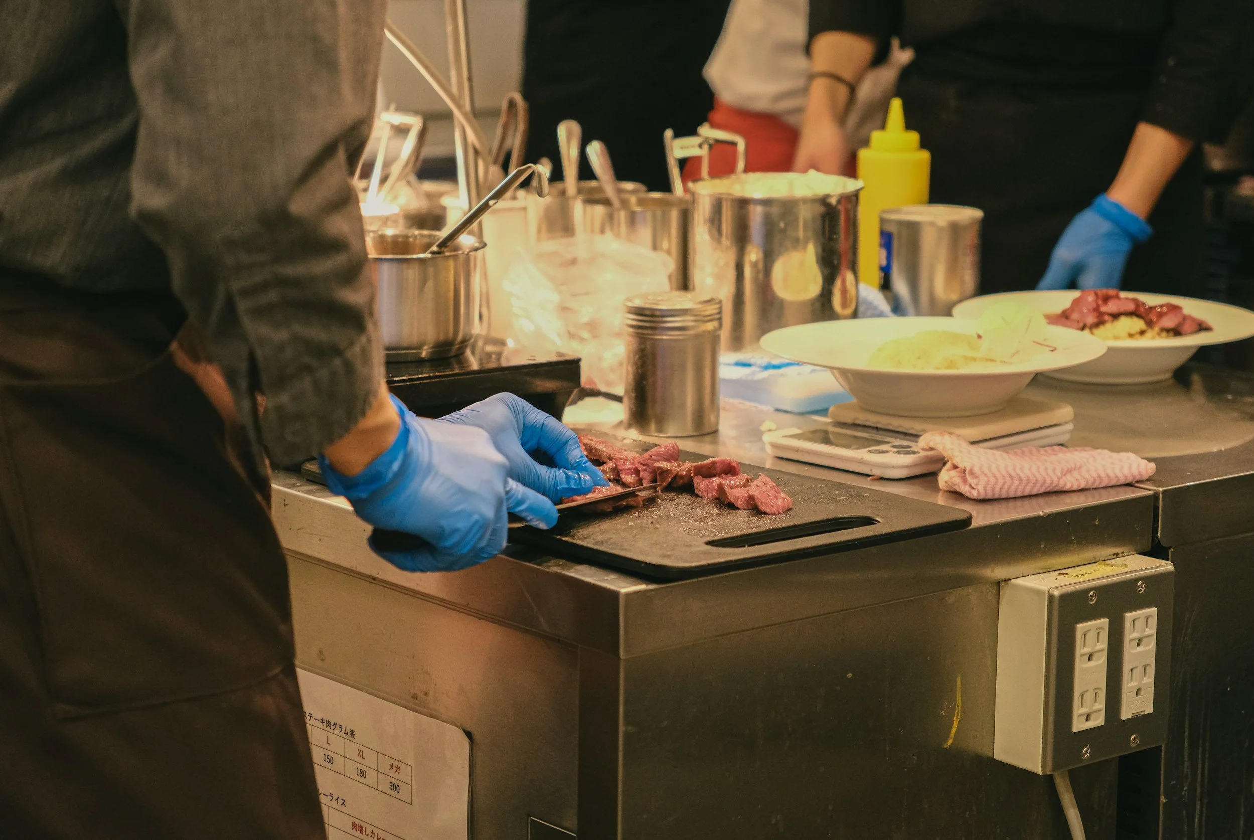 Chef preparing food professional catering, compliance allergy audits, operational support independent catering businesses