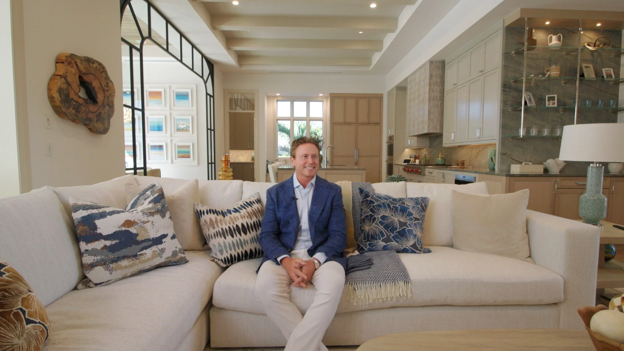 Interview participant seated in a light-filled home during a personal story production