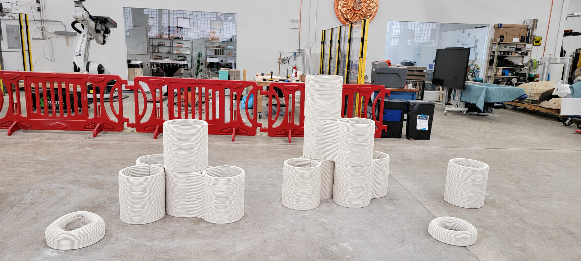 Testing new cement recipes to use with a cement 3D printer for Sika. These are test flower pots printed within minutes.