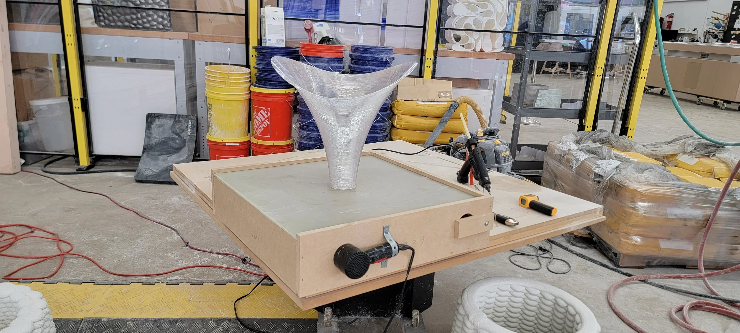 Prototyping a vase using non planar 3D printing with a 6 axis robot.