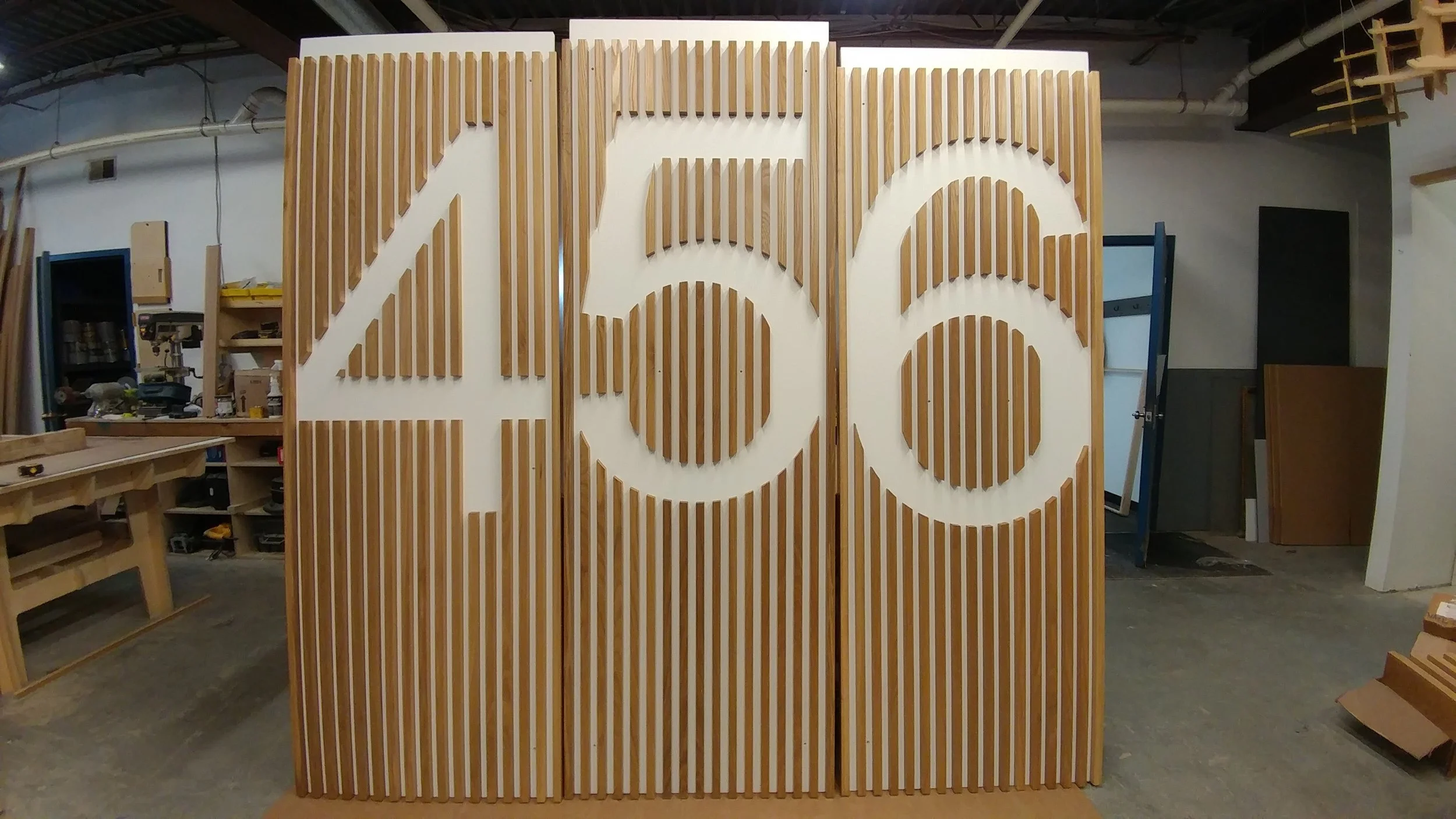 Custom White Oak slat wall feature for residential building in NYC.