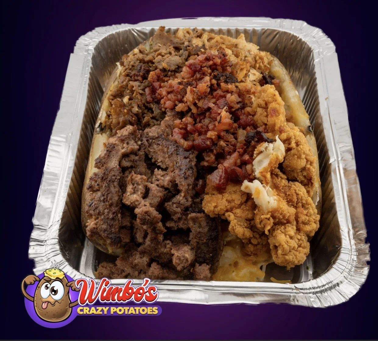 Baked potato topped with chili, shredded cheese, and bacon bits in a takeout container with Wimbo's Crazy Potatoes logo.