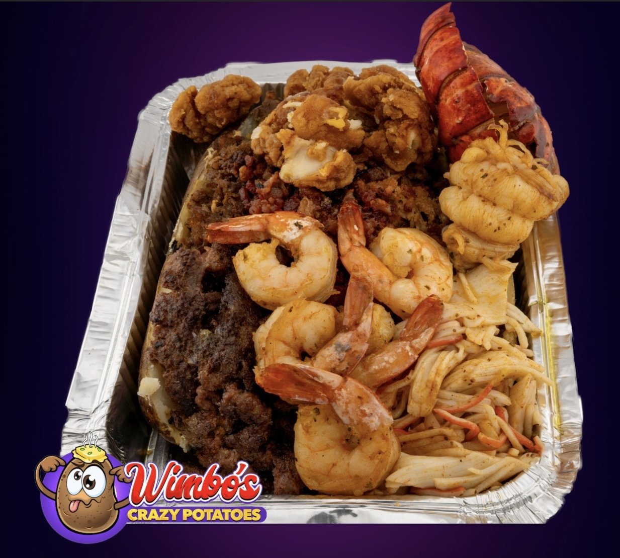 Heaping serving of seafood with shellfish, shrimp, crawfish, and seafood casserole in a disposable aluminum tray with Wimbo's Crazy Potatoes logo