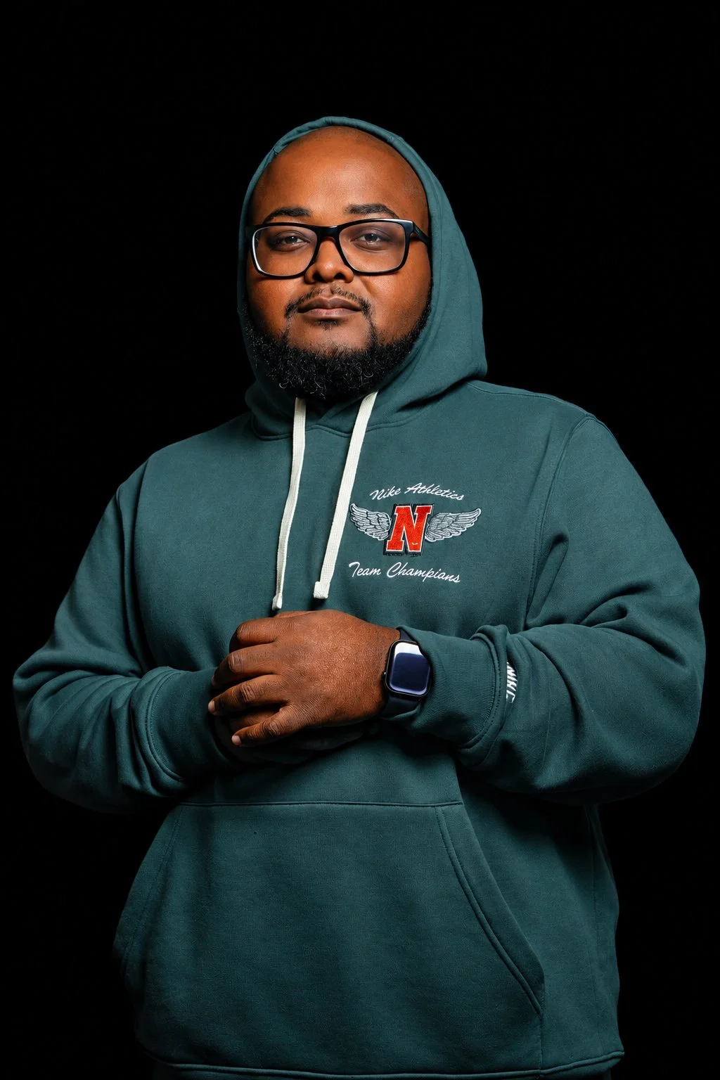 Studio portrait against a black background by Pugh Logic Productions.