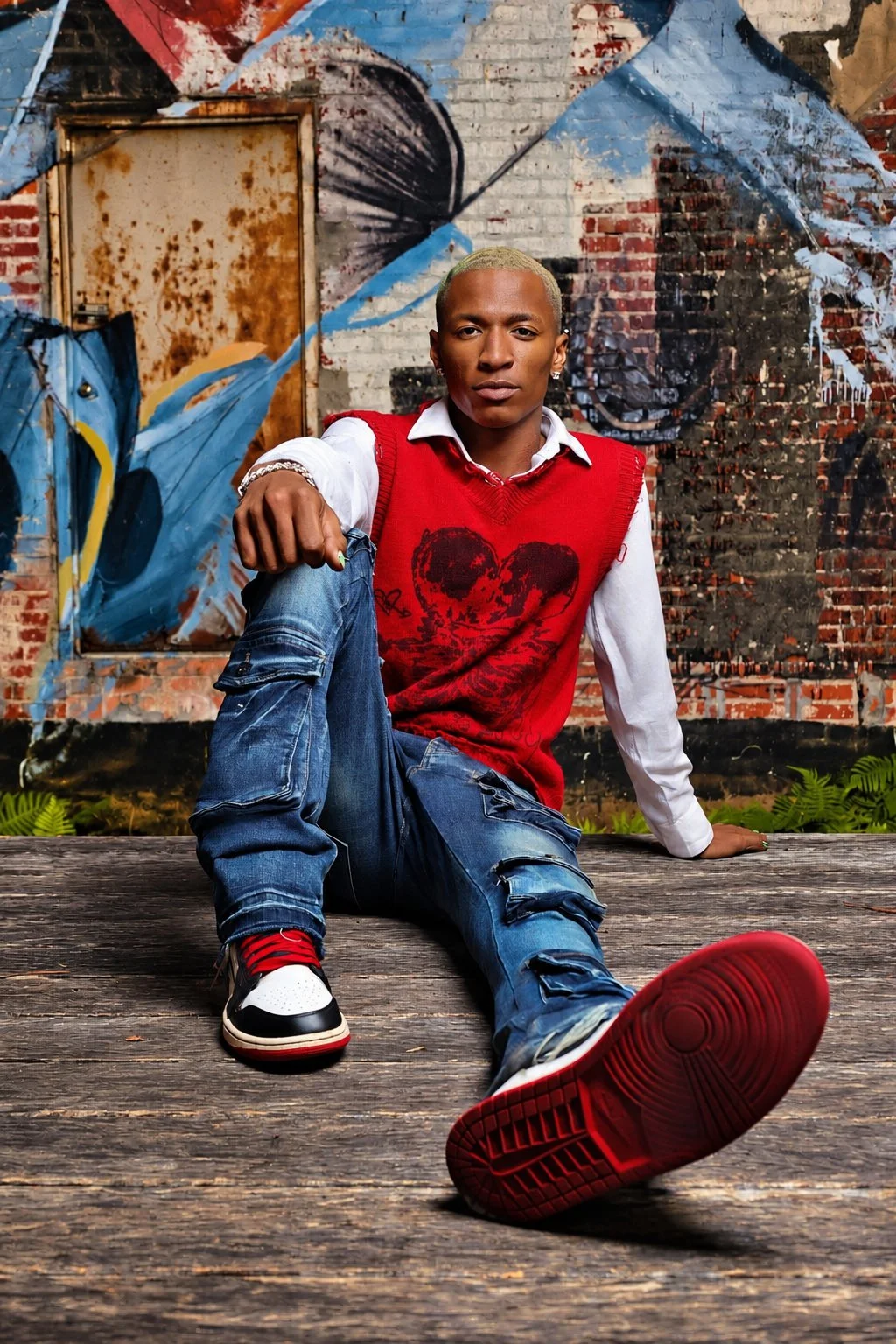 Urban portrait in a red sweater by Pugh Logic Productions.