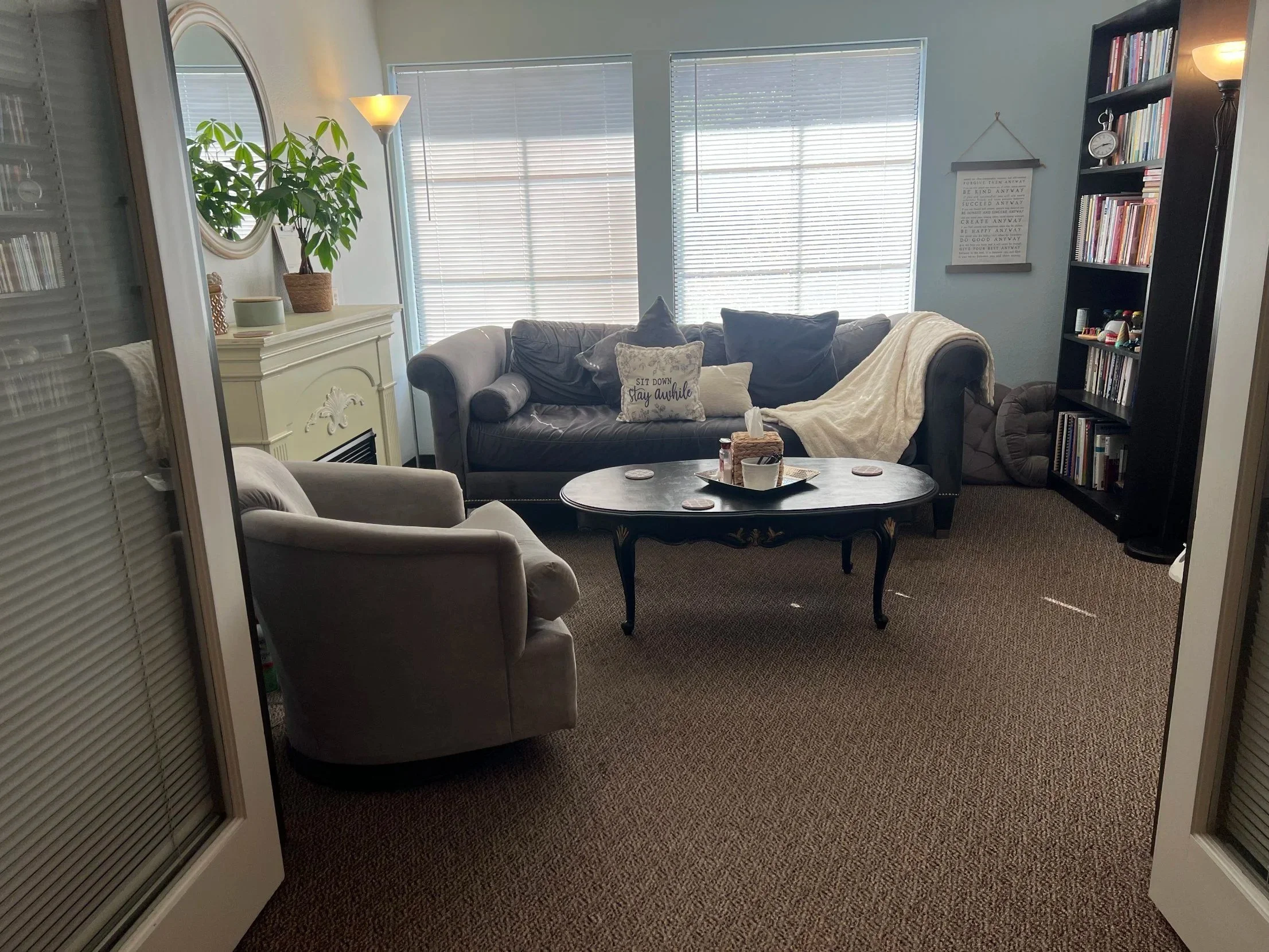 Counseling office at Safe Harbor Counseling Center in Old Town Temecula, with a sofa, armchair and bookshelves
